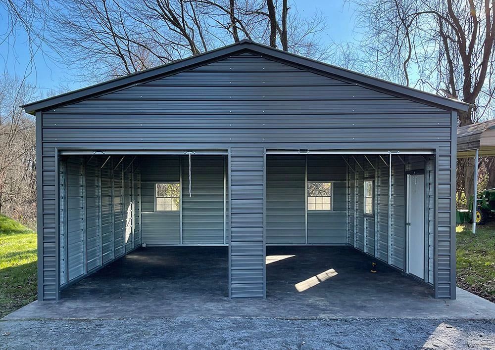Gray metal carport garage with peaked roof